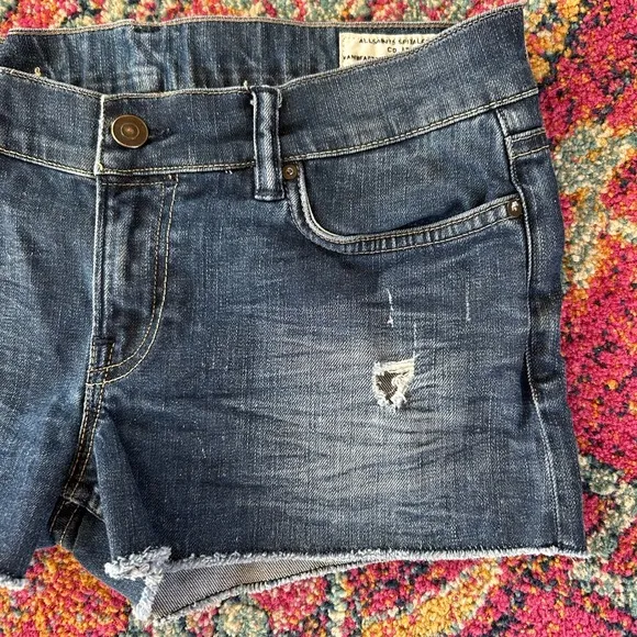 All Saints | Women’s blue distressed raw hem Jean shorts, front/back pockets, 28